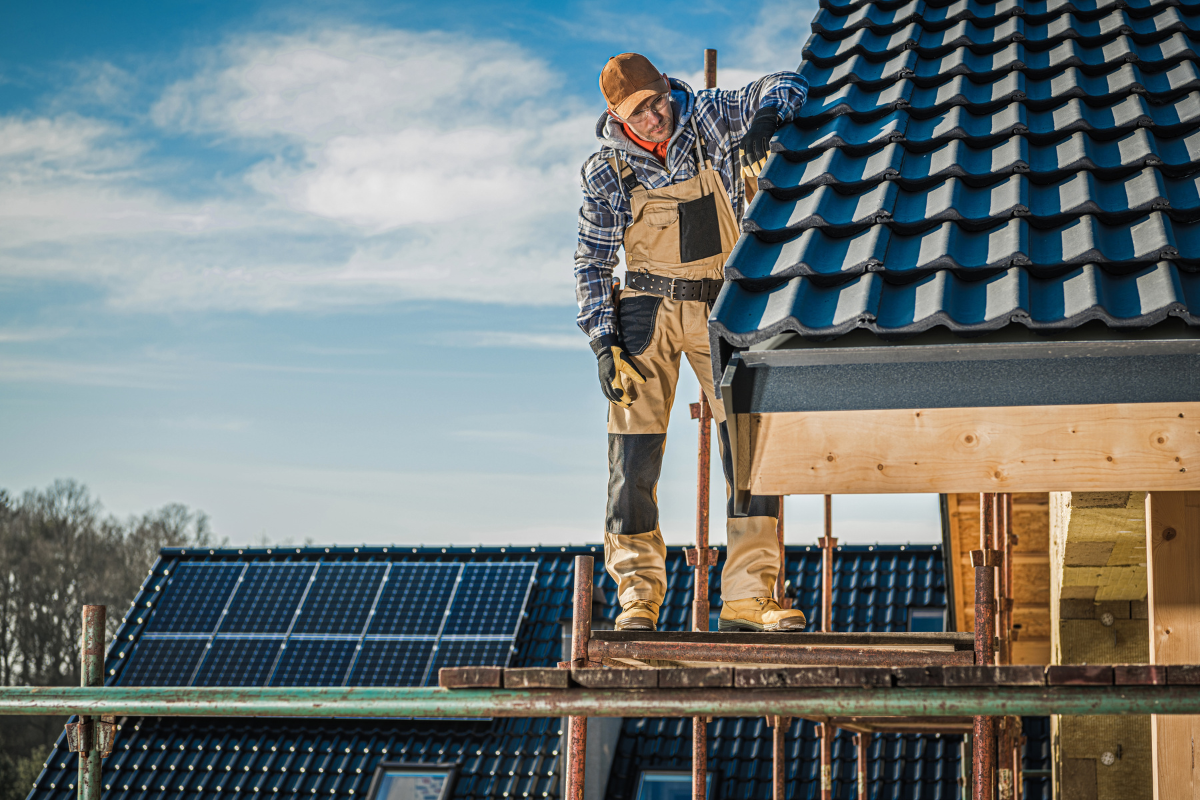 Solar Roofs - Stock Feature Image from Canva of a tile roof being installed